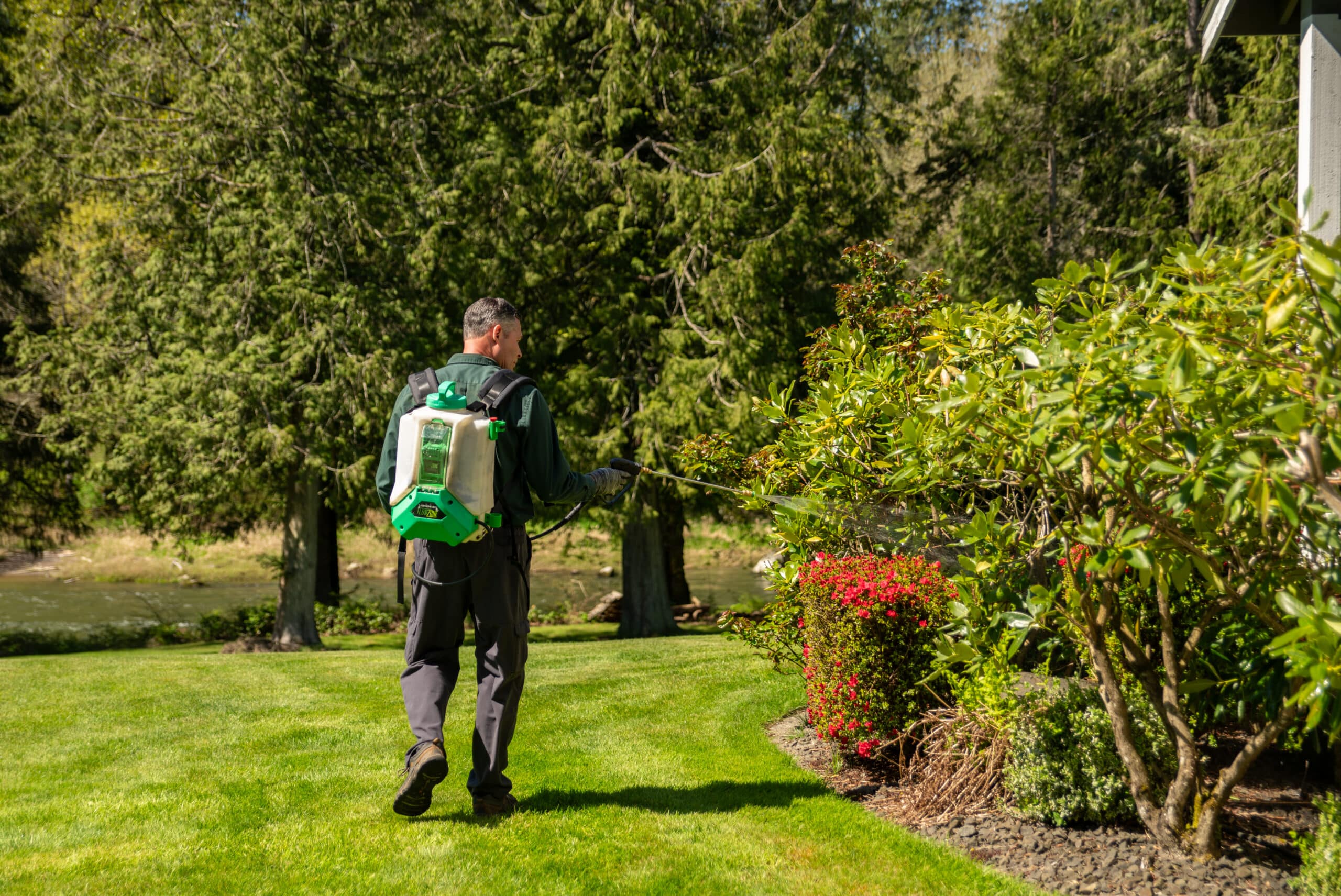 All Seasons Pest Control technician performing a summer pest control treatment at a home in Pierce County, Washington.