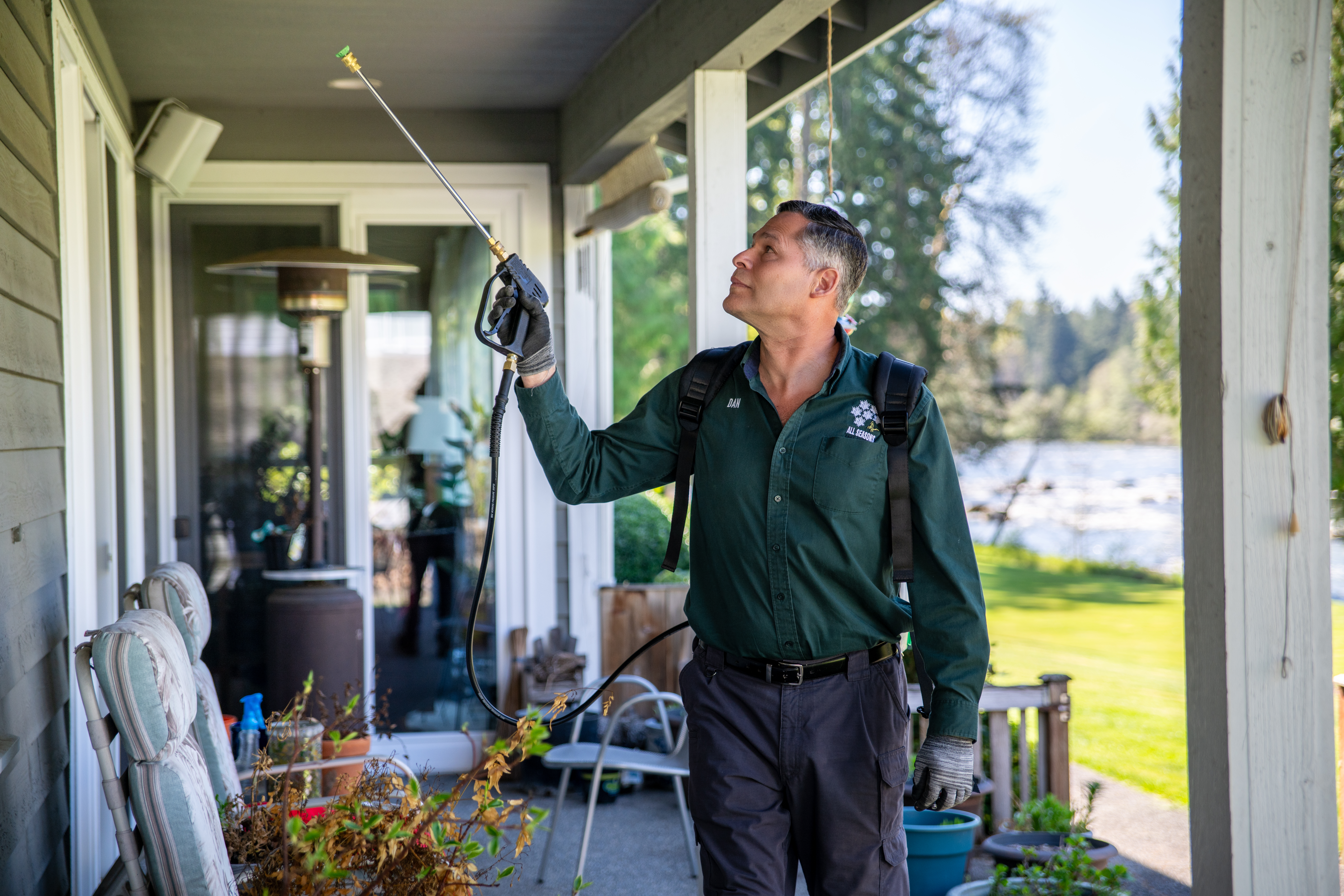 Professional Pest Inspection in Pierce County All Seasons Pest Control technician performing a pest inspection in Pierce County